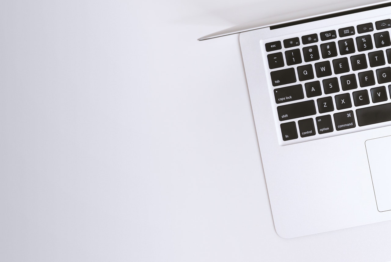 partial shot of a silver laptop